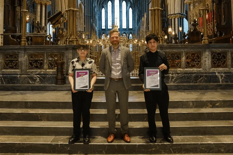 Two children receiving awards at the Young Composers Competition